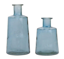Load image into Gallery viewer, Two blue glass tapered bottle vases of different sizes, set against a white background.