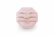 Load image into Gallery viewer, Set of gold rings with a pink gemstone on a pink octagonal stand