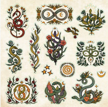 Load image into Gallery viewer, Collection of decorative snake sticker designs with floral elements on a beige background