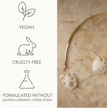 Load image into Gallery viewer, Product packaging with vegan, cruelty-free, and sulfate-free icons on a marble background.