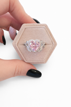 Load image into Gallery viewer, Pink heart crystal zircon ring with cubic zirconia accents and silver plated band featuring butterfly knot details

