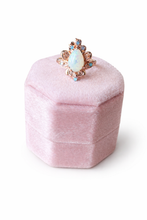 Load image into Gallery viewer, Opal ring with rose gold setting on a pink velvet box against a white background
