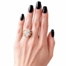 Load image into Gallery viewer, layered gold ring set styled on hand
