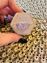Load image into Gallery viewer, Hexagonal jewelry box with a heart-shaped pink gemstone ring on a patterned fabric background
