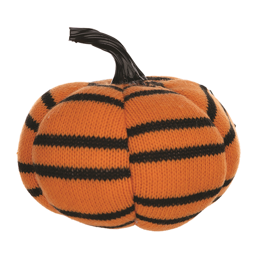 Knitted pumpkin toy with black stripes on a white background