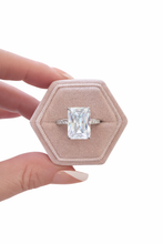Load image into Gallery viewer, Valentina ring in a hexagonal pink box held by a hand on a white background
