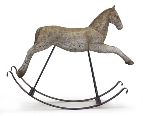 Rustic rocking horse décor on metal stand with weathered antique finish, vintage farmhouse accent piece
