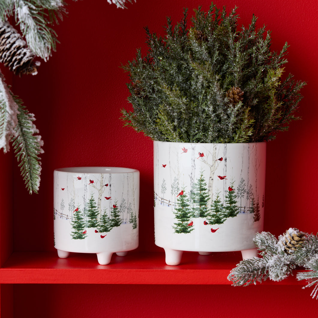 Winter cardinal planters filled with holiday greenery