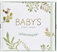 Load image into Gallery viewer, Book titled 'Baby's First Years: A Modern Memory Book' with green leaf designs on a white background
