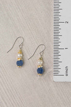 Load image into Gallery viewer, Pair of earrings with blue and pearl beads next to a ruler on a gray background
