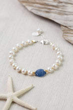 Load image into Gallery viewer, Close up of handcrafted freshwater pearl and kyanite bracelet with sterling silver lobster clasp
