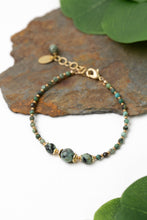 Load image into Gallery viewer, African turquoise bracelet with polished stone focal and matte gold spacer beads, adjustable design
