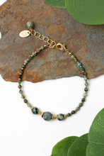 Load image into Gallery viewer, Simple African turquoise gemstone bracelet with matte gold accents
