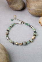 Load image into Gallery viewer, Close up of multistrand aquamarine abalone bracelet with Czech glass, Roman glass, pearl, and antique silver clasp

