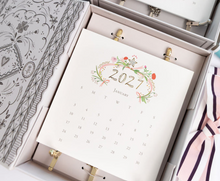 Load image into Gallery viewer, Karen Adams 2027 calendar gift box with ribbon
