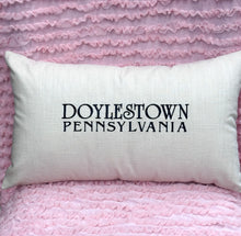 Load image into Gallery viewer, White pillow with 'Doylestown Pennsylvania' text on a pink textured background
