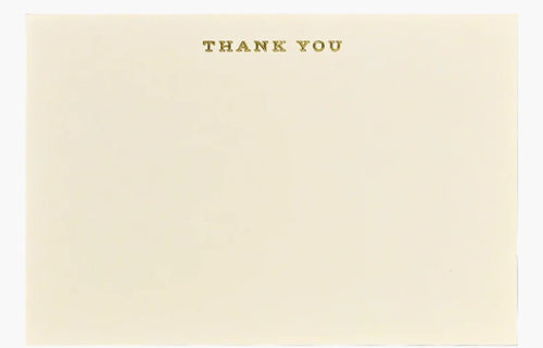 A stack of plain ecru flat cards with 'THANK YOU' text stamped in gold foil on the top center.