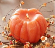 Load image into Gallery viewer, Flameless pumpkin candle resting on a fall wreath
