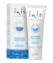 Load image into Gallery viewer, Packaging of Inis Nourishing Hand Cream, featuring a white box with blue sea elements and a tube of hand cream, both with the brand's logo and ocean-themed graphics.
