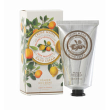 Load image into Gallery viewer, A tube of hand cream next to its packaging box, which has a illustration of citrus fruits and leaves, indicating the fragrance of the product.
