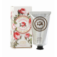 Load image into Gallery viewer, A tube of hand cream with a floral design on the packaging, alongside its box which has a more detailed floral pattern and the text &#39;CREME MAJESTY&#39;.
